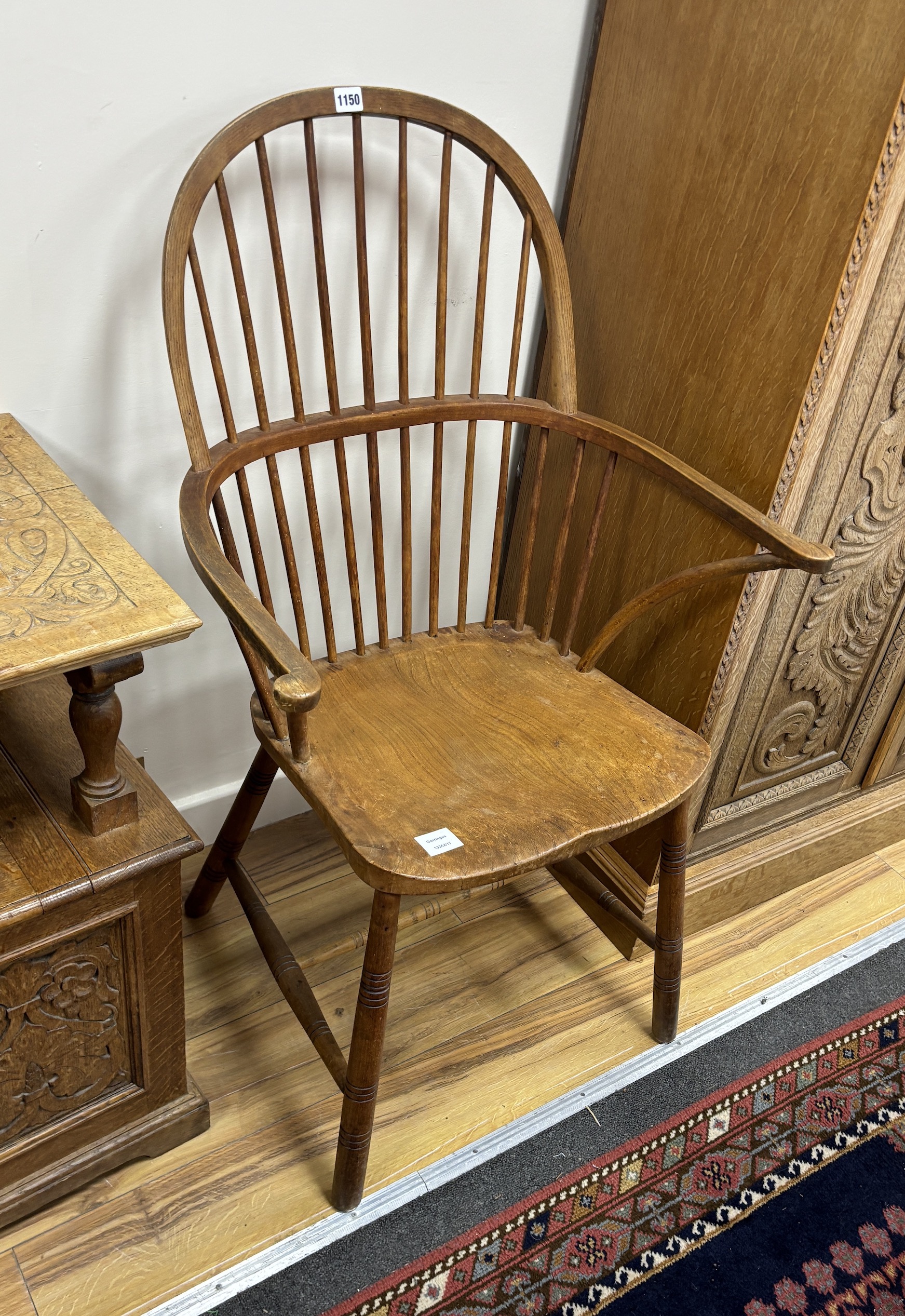 An elm and beech Windsor comb back elbow chair, width 65cm, depth 42cm, height 108cm